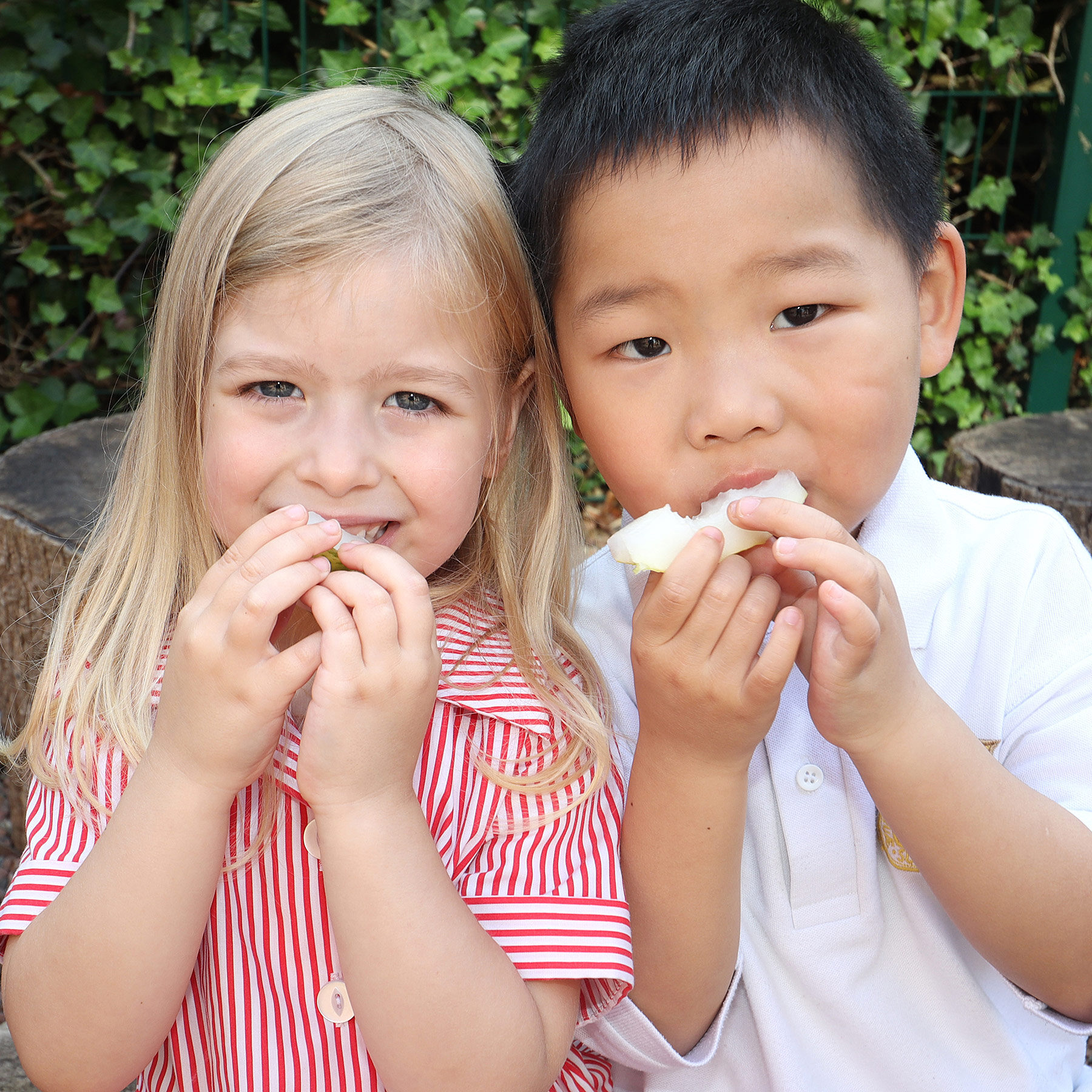 Students eating a pear