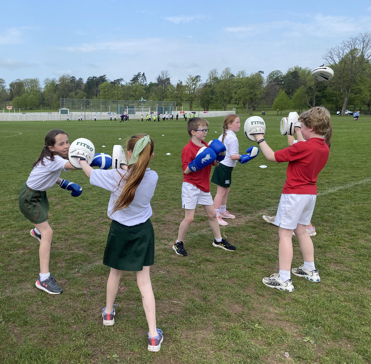 Students practising boxing outside