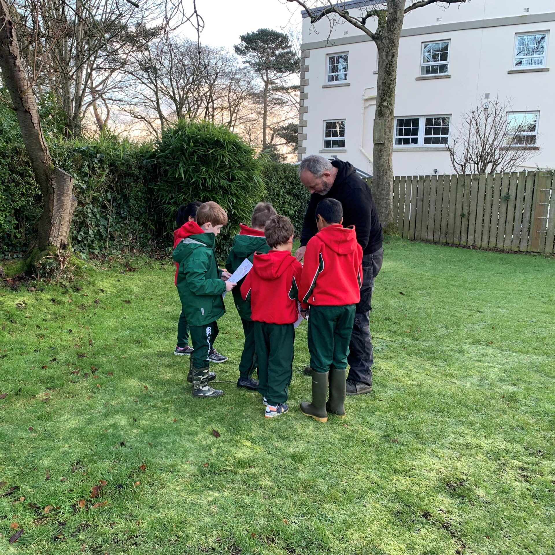 Teacher talking to students outdoors