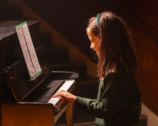 Student playing piano